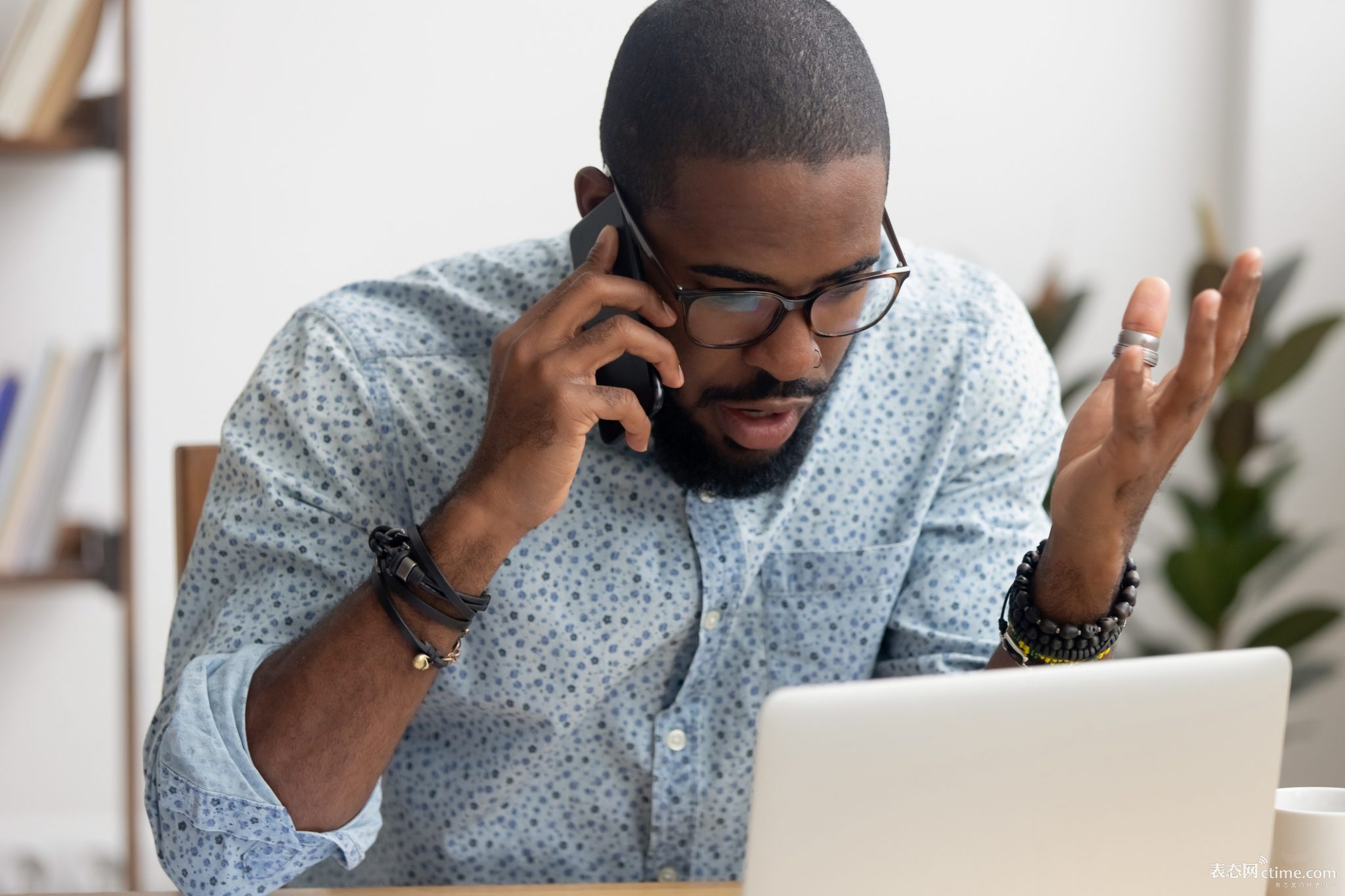 angry-mad-african-american-businessman-talking-on-cellphone-in-office.jpg